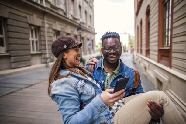 istock Happy couple using mobile phone 1393062751