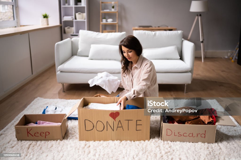 Donating Decluttering And Cleaning Up Wardrobe Donating Decluttering And Cleaning Up Wardrobe Clothes Decluttering Stock Photo