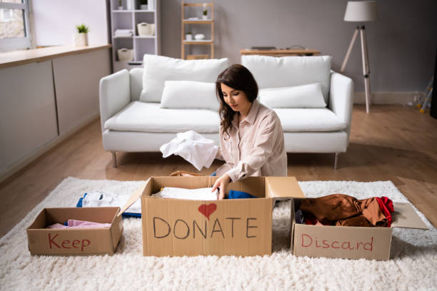 Donating Decluttering And Cleaning Up Wardrobe Donating Decluttering And Cleaning Up Wardrobe Clothes cluttered stock pictures, royalty-free photos & images