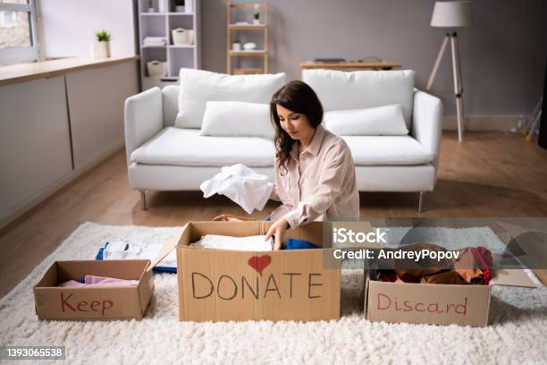 Donating Decluttering And Cleaning Up Wardrobe Stock Photo - Download Image Now - Decluttering, Neat, Organization