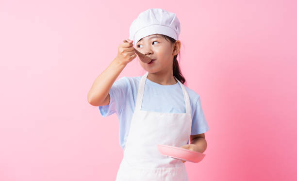 istock Image of Asian child practicing to be a chef 1393069299