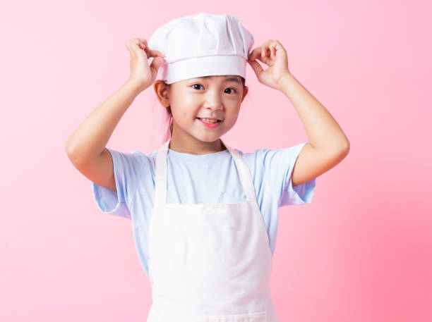istock Image of Asian child practicing to be a chef 1393069305