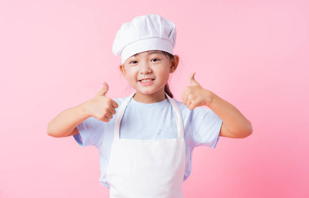 istock Image of Asian child practicing to be a chef 1393069309