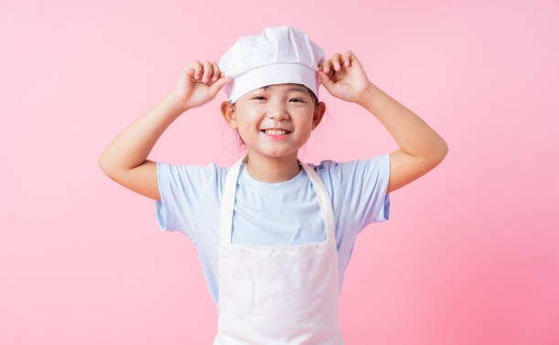 istock Image of Asian child practicing to be a chef 1393069311