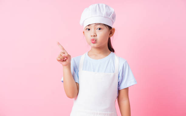 istock Image of Asian child practicing to be a chef 1393069313