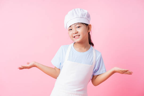 istock Image of Asian child practicing to be a chef 1393069314