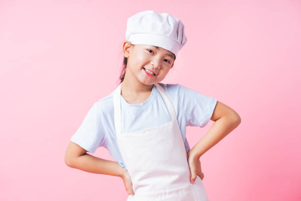 istock Image of Asian child practicing to be a chef 1393069315