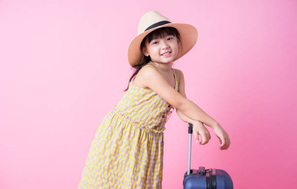 istock Image of Asian child with suitcase, summer concept 1393069354