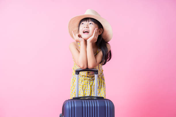 istock Image of Asian child with suitcase, summer concept 1393069360