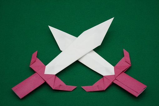 A sword that represents a conflict expressed in origami