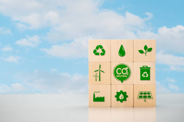 CO2 Carbon Neutral concept. Net zero and carbon neutral concept. Net zero greenhouse gas emissions target. Climate neutral long term strategy. wooden cubes with green icon on blue background. CO2 neutral commitment in business, finance and industry to reduce carbon dioxide emissions and limit global warming and climate change. wooden cubes with green icon on blue background. larnaca international airport stock pictures, royalty-free photos & images
