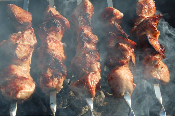 istock Grilled kebabs on skewers in the open air. 1393074710