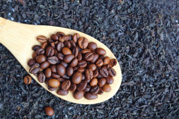 istock A spoon with coffee beans lies on loose leaf tea. 1393074780