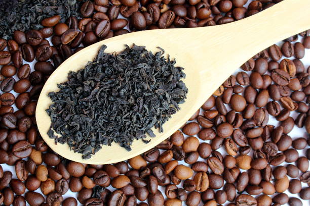 istock A spoon with dry leaf tea lies on spilled coffee. 1393075310