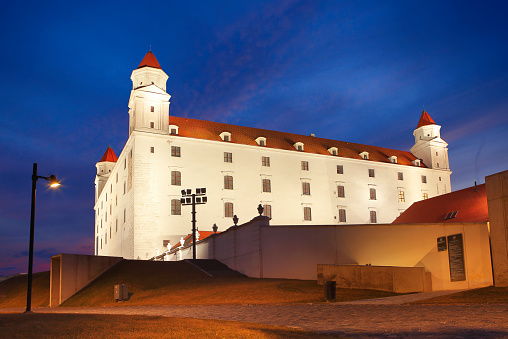 Bratislava, Slovakia - Feb 21, 2022:  Bratislava Castle by night, the most famous landmark in Slovakia, built in 9. century