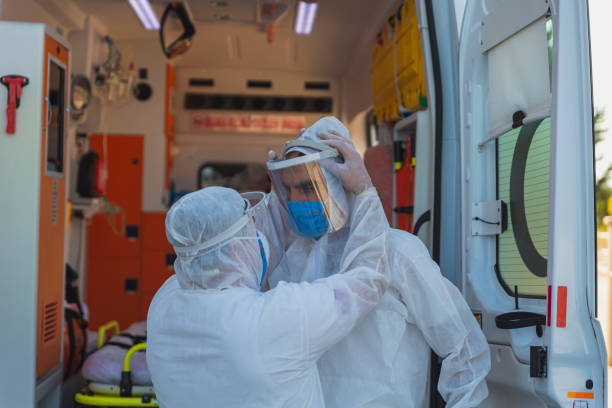 istock Medical Team in Full Infectious Disease Control Attire 1393085584