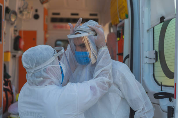 istock Medical Team in Full Infectious Disease Control Attire 1393085599