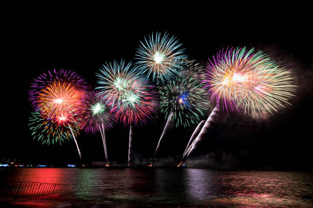 istock Amazing beautiful colorful fireworks display on celebration night 1393085870