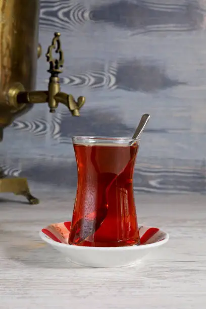a glass of Turkish tea and a samovar on the table
