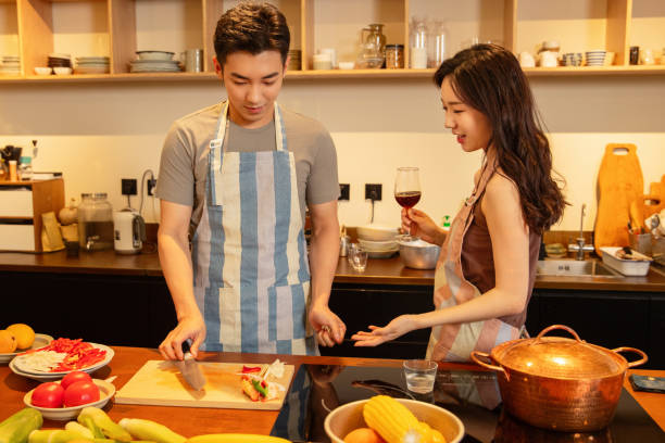 istock The young couple cooking at home 1393089516
