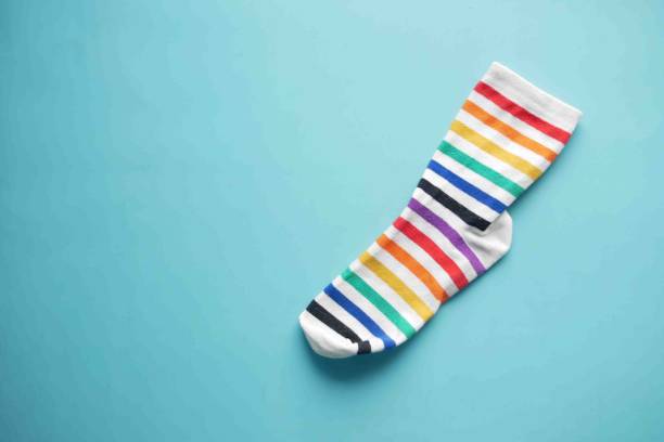 istock colorful sock on green background with copy space , 1393089595