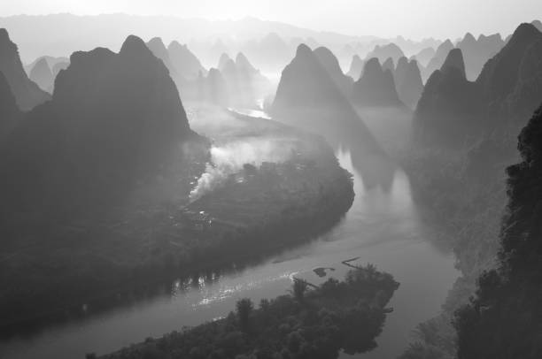 istock Magnificent sunrise-dawn over Lijiang River and peaks (black and white) 1393090488