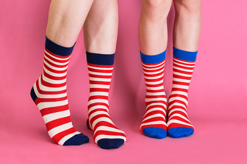 striped bright socks on a pink background\