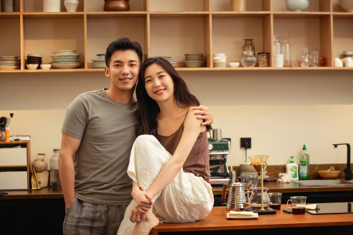 Young couples make coffee at home