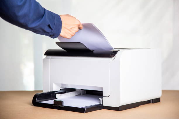 istock Printer, copier, scanner in office. Workplace ,photocopier machine for scanning document printing a sheet paper and xerox photocopy. 1393097413