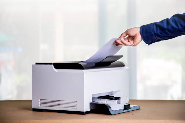 istock Printer, copier, scanner in office. Workplace ,photocopier machine for scanning document printing a sheet paper and xerox photocopy. 1393097421
