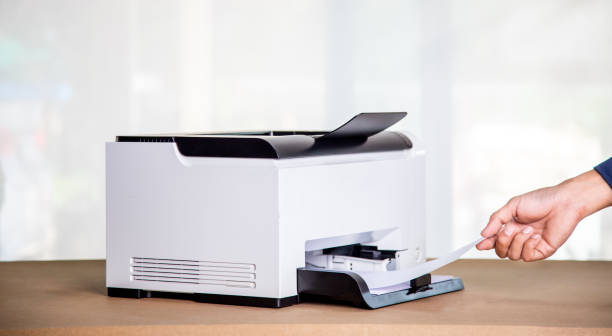 istock Printer, copier, scanner in office. Workplace ,photocopier machine for scanning document printing a sheet paper and xerox photocopy. 1393097425