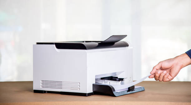 Printer, copier, scanner in office. Workplace ,photocopier machine for scanning document printing a sheet paper and xerox photocopy. stock photo