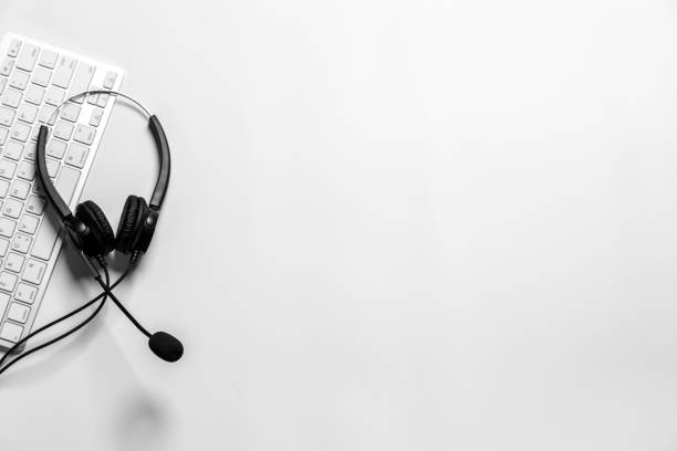 istock Headset and customer support equipment at call center ready for actively service , Communication support, call center and customer service help desk. for (call center) concept . 1393097434