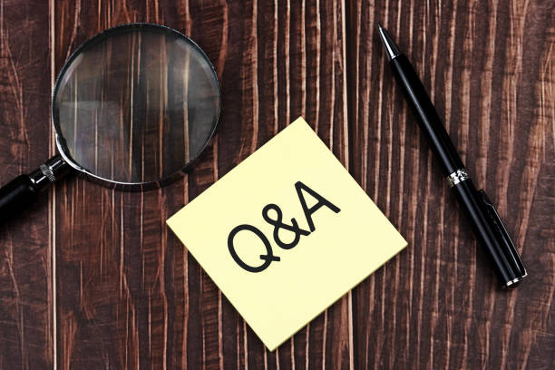 istock Q&A text on adhesive paper with pen and magnifying glass 1393097697