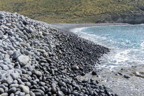 istock PARADISIACAL BEACH WITH ROUND STONES 1393099045