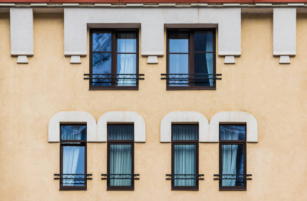 istock Windows in row on facade of urban building 1393099989