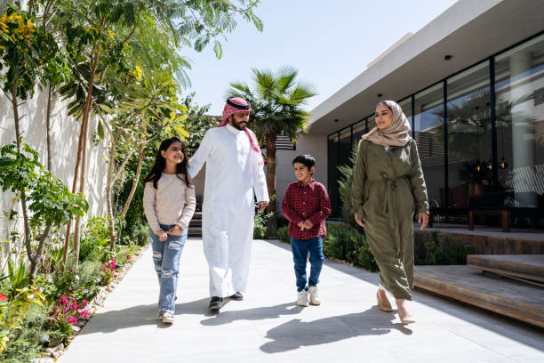 istock Young Saudi children walking outdoors with their parents 1393101436