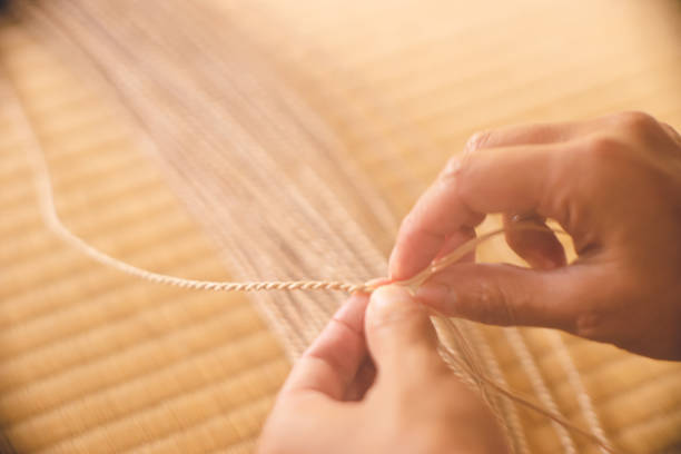 Beige fabric texture detailed showing the complex weave pattern.