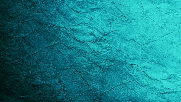 istock Blue green abstract background. Gradient. Toned rough cracked stone surface. Teal background with space for design. 1393103261