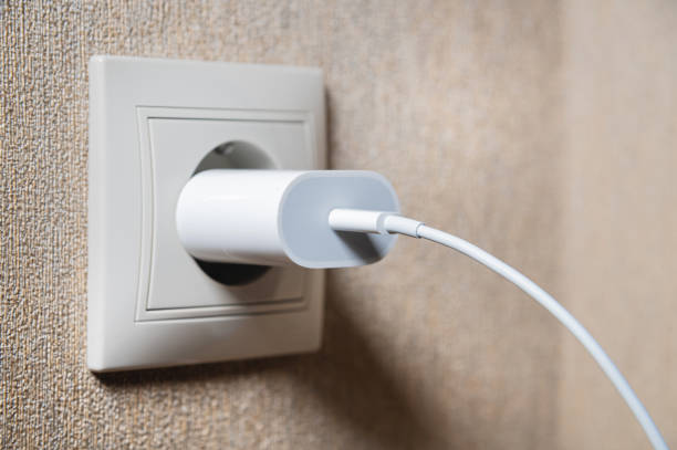 istock Close-up of a usb charging unit with a usb c connector and a white wire. European socket. The concept of providing electricity to the European Union 1393104267