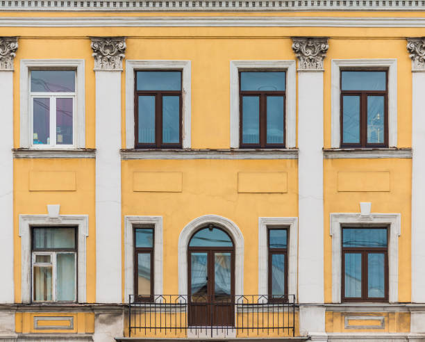 istock Balcony and windows in row on facade of historic building 1393104672
