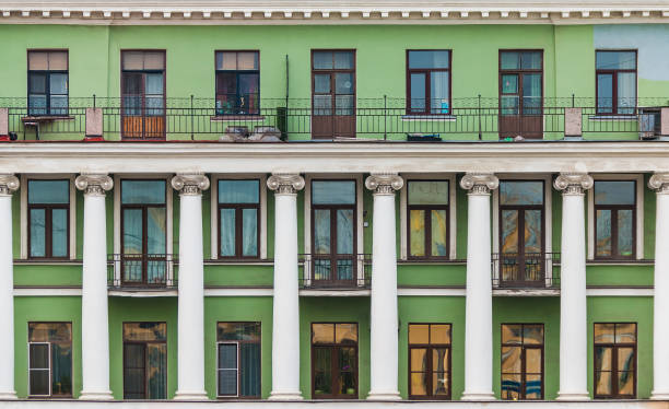 istock Balconies, columns and windows in row on facade of historic building 1393105345