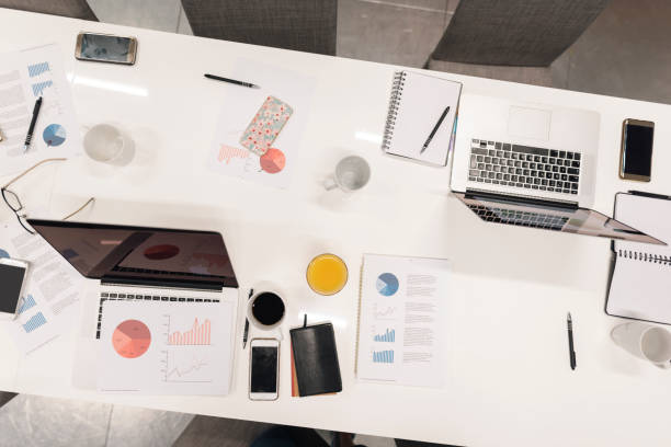 istock Top view of office desk 1393105528