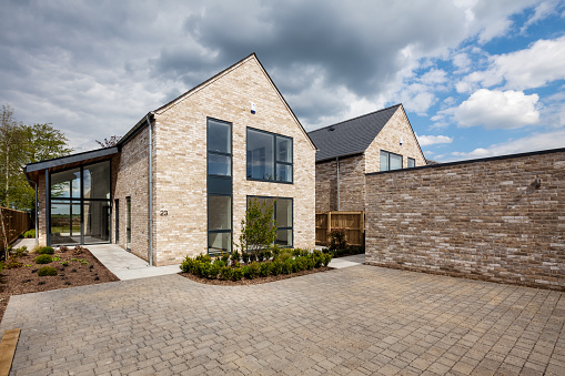 High quality stock photo of the exterior of a home in a residential neighborhood