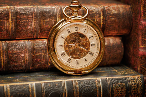 istock Old Books and Vintage pocket watch 1393111554