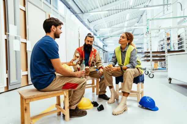 istock Teamwork in industry, diverse multi ethnic employees eating breakfast 1393111754