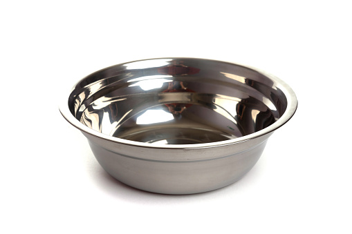stainless steel metal bowl on white isolated background.