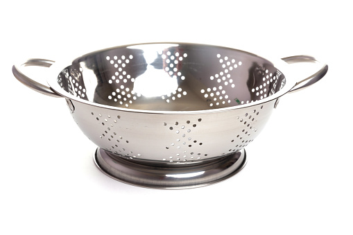 metal colander with handles and stand on a white isolated background.