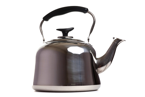 metal teapot with handle on white isolated background.