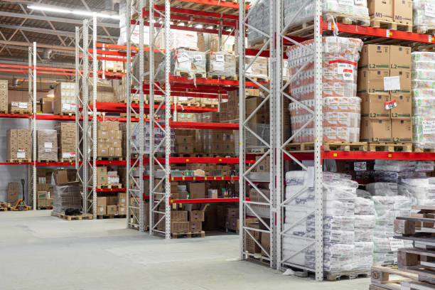 istock large warehouse with aluminum shelving system and cardboard boxes 1393114082